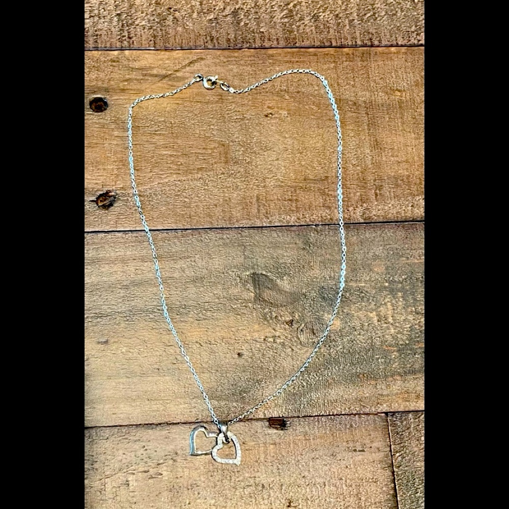 Silver Diamond encrusted heart necklace.